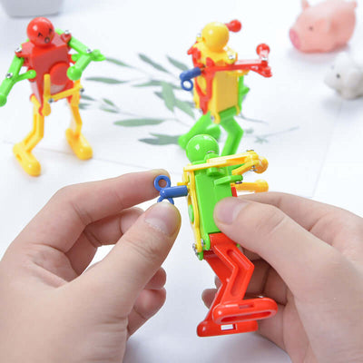 The Clockwork Dancing Robot is a creative and entertaining toy that provides endless fun for kids. Powered by a simple clockwork mechanism, this charming robot performs gymnastics moves, promoting active play and curiosity. Perfect as a Christmas gift or 